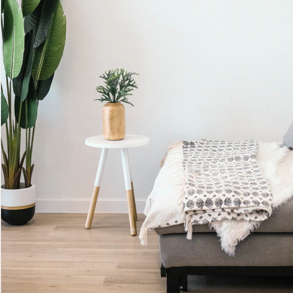 
      vase on a side table next to a sofa