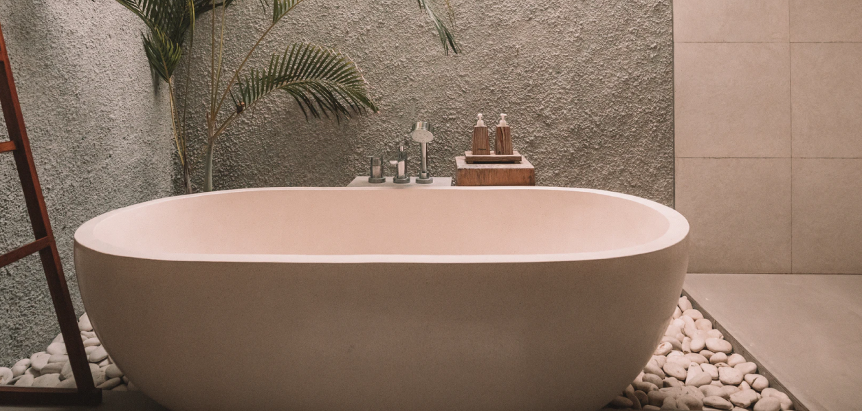 
      picture of minimalist style bathtub on white stones